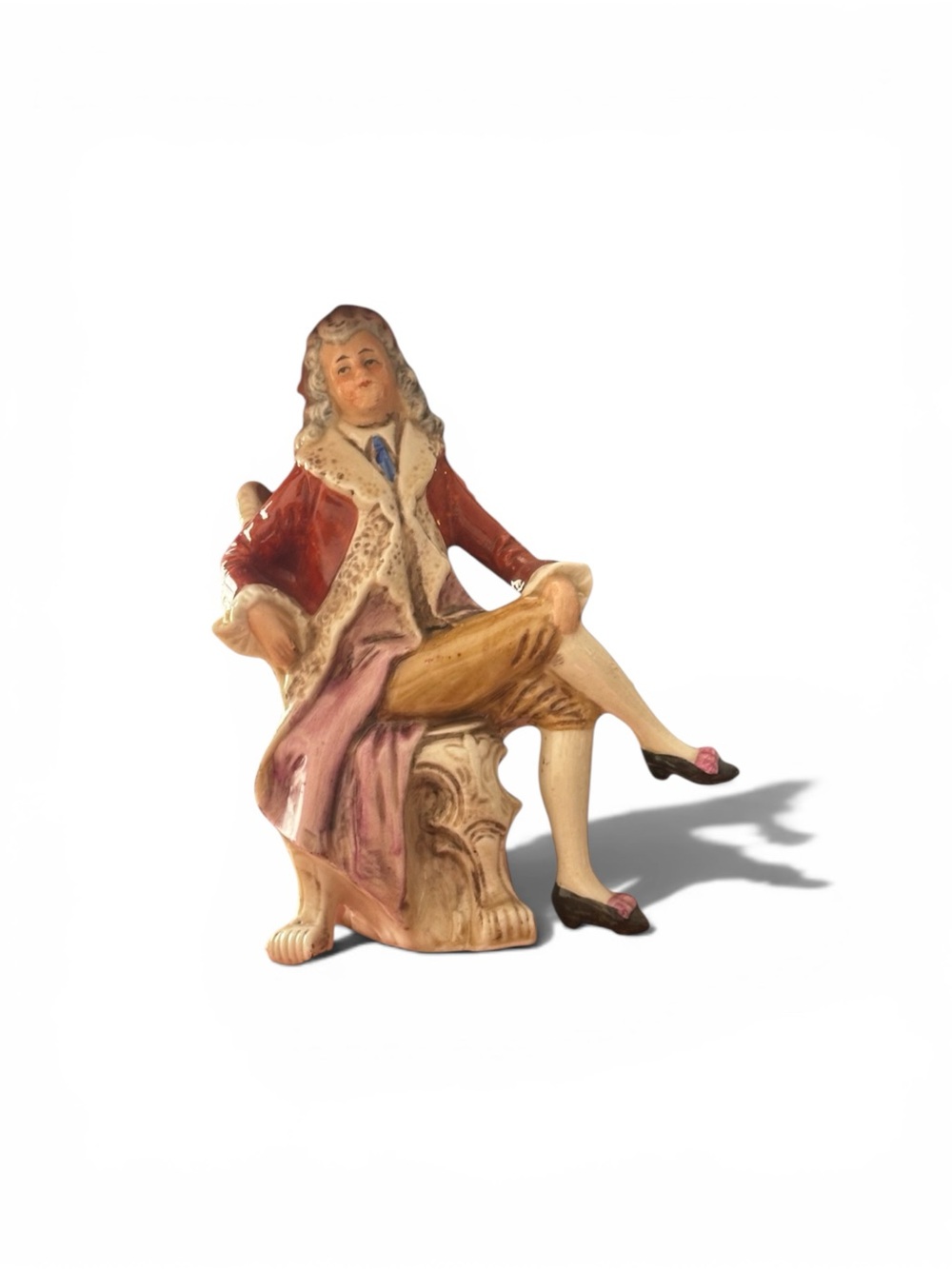 Porcelain Seated Gentleman Figurine in Red and Pink